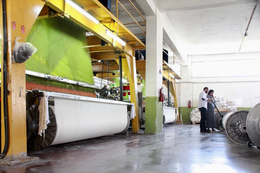 A large green jacquard loom in a mill in Turkey
