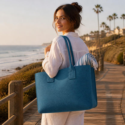 Ocean Blue Portofino felt tote on a seaside boardwalk
