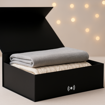 Black box with a gray blanket inside, set against a warm light background- magnetic closure icon