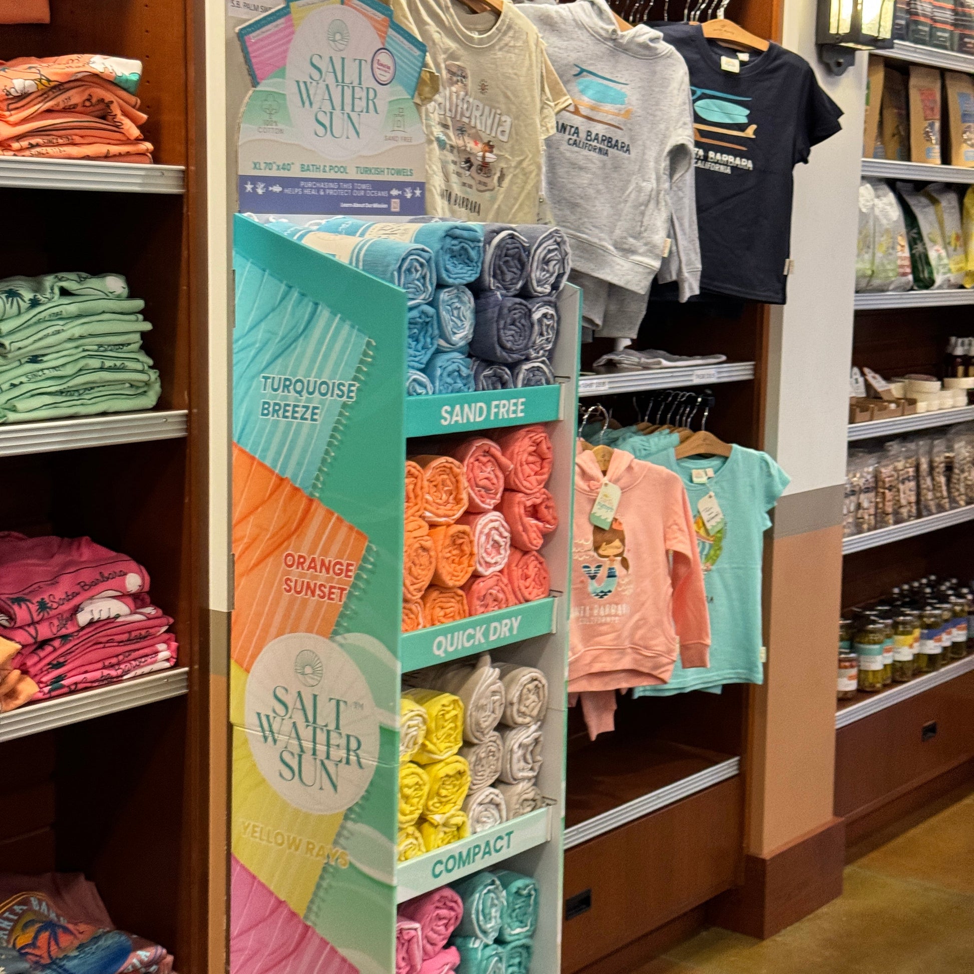 Display of towels and travel supplies in an airport gift shop