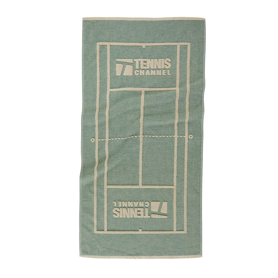 A rectangular beach towel featuring a tennis court design in sage green with cream-colored lines and 'TENNIS CHANNEL' branding, shown flat against a white background.