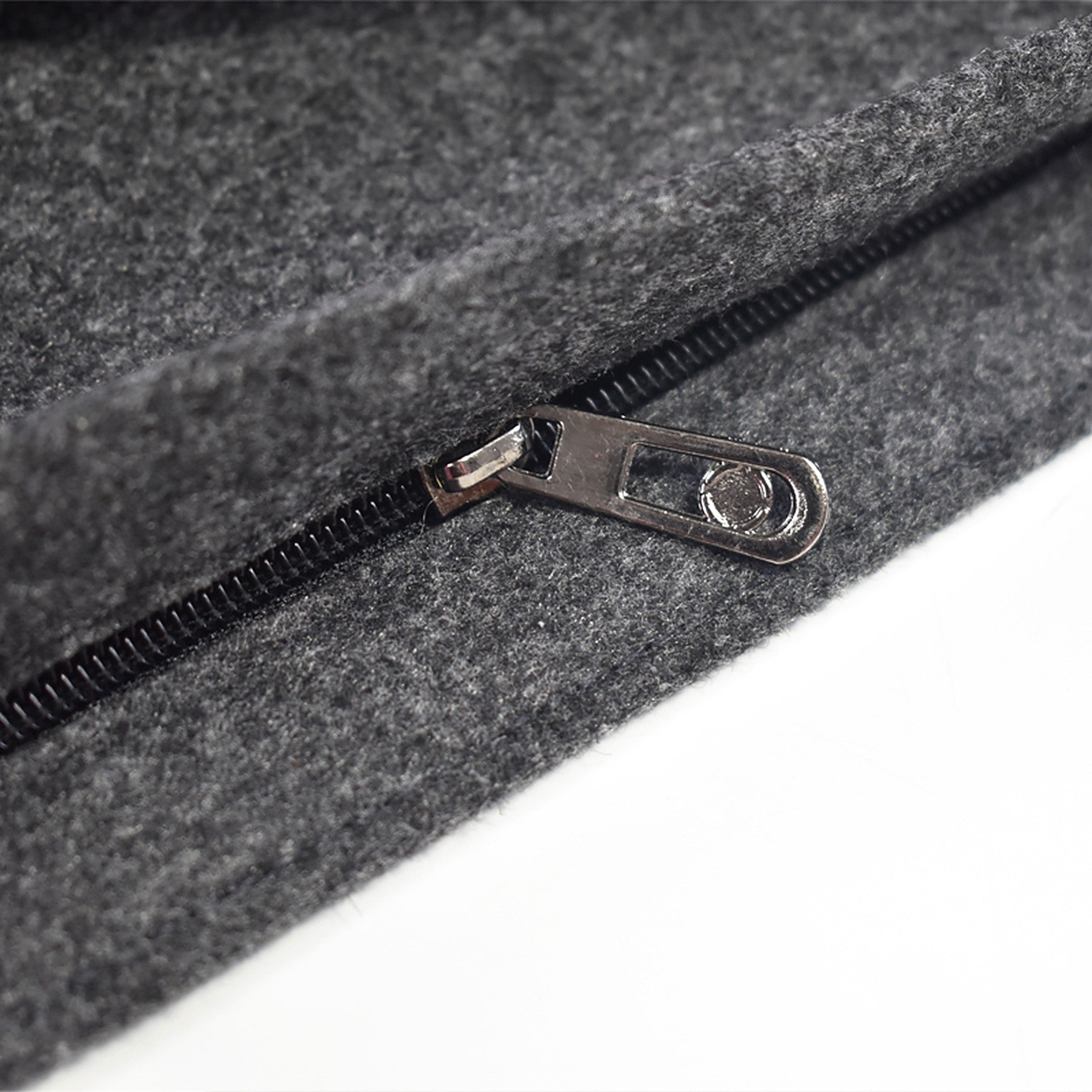 Close-up of the zipper on the charcoal wool tote