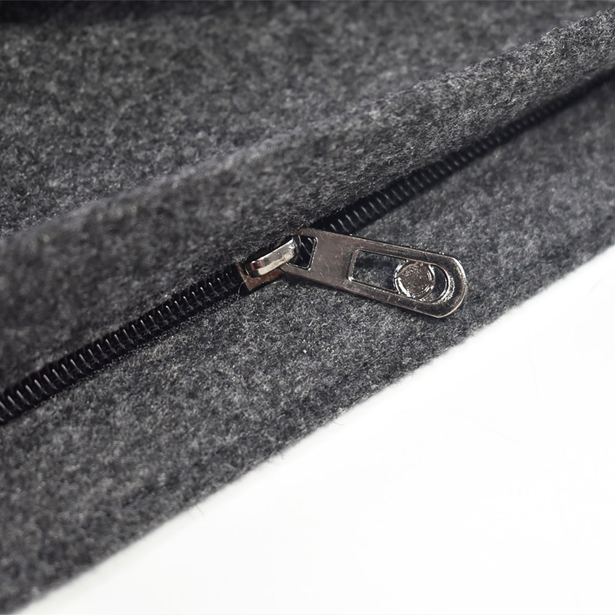 Close-up of the zipper on the charcoal wool tote