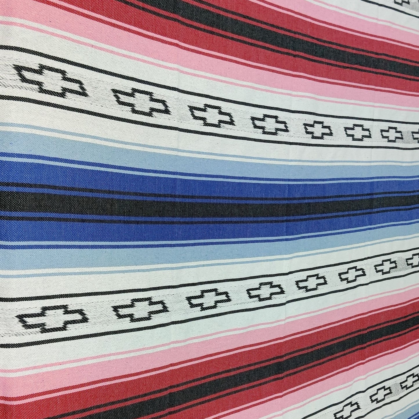 custom mexican blanket Striped tablecloth with geometric pattern on a table